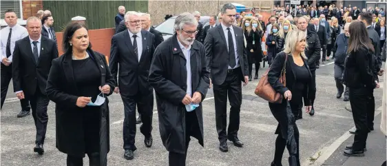  ??  ?? Cortege: Mary Lou Mcdonald, Gerry Adams and Michelle O’neill at the Storey funeral