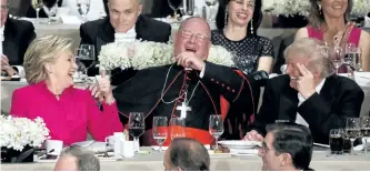  ?? EVAN VUCCI/AP PHOTO ?? Republican presidenti­al candidate Donald Trump, right, Cardinal Timothy Dolan, Archbishop of New York, center, and Democratic presidenti­al candidate Hillary Clinton share a laugh during the Alfred E. Smith Memorial Foundation dinner, Thursday in New...