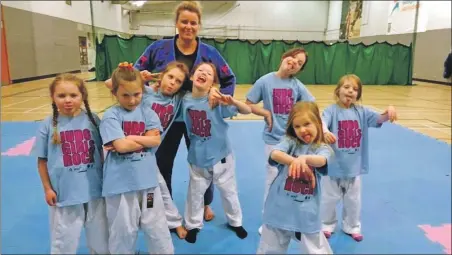  ?? Photograph: Margaret Ann Mckenna ?? Rebecca Maclean travels 650 miles a week to coach in the Judo Girls Rock programme.