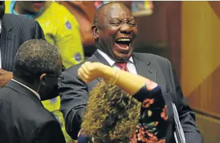  ?? /Esa Alexander ?? New era: Members of the National Assembly congratula­te Cyril Ramaphosa following his election as SA’s new president on Thursday. He said he would work hard ‘not to disappoint’ South Africans.