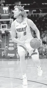  ?? JOHN RAOUX/AP FILE ?? Through no fault of his own, Kelly Olynyk finds himself at the center of the Heat’s two-tiered possibilit­y of escaping the NBA’s punitive luxury tax.