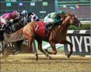  ?? PHOTO SUSIE RAISHER/NYRA ?? Chad Brown trained Timeline with Javier Castellano board, center, racing at Belmont Park, June 3, 2018.