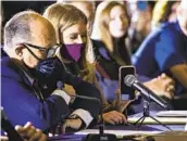  ?? SAMUEL CORUM GETTY IMAGES ?? Jenna Ellis holds a cellphone to the microphone so President Donald Trump can speak Wednesday.