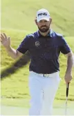  ?? AP PHOTO ?? ROLLING: Co-leader Louis Oosthuizen waves after sinking a birdie putt on No. 5 yesterday.