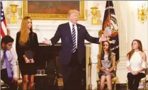  ??  ?? US President Donald Trump holds a listening session at the White House to discuss school safety and shootings with surviving students and the families of victims