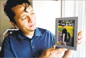  ?? Don MacKinnon For The Times ?? NOW LIVING in British Columbia, Carlos Rivera is battling to regain custody of his son, Enrrique, 9, who lives with foster parents in Washington state a mere 90 miles away. The pair have been separated since 2019.