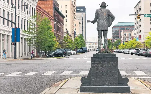  ?? ROBERT RAUSCH PHOTOS/THE NEW YORK TIMES ?? A statue of Hank Williams Sr. on the corner of Commerce St and Tallapoosa St. in downtown Montgomery, Ala.