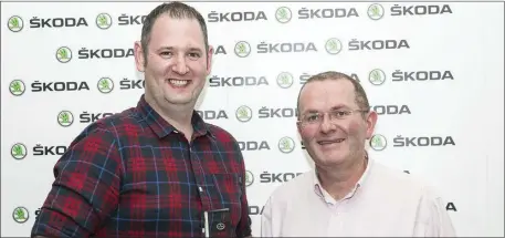  ??  ?? Eoin McGuinness of Burns Car Sales, Ballisodar­e, winner of the National Skoda Challenge, receiving his award from John Donegan, Brand Director, Skoda Ireland.