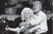  ?? AP FILE ?? Kenny Rogers, seen rehearsing a song for a 1983 TV appearance with Dolly Parton, died of natural causes at his Georgia home on Friday. He was 81.