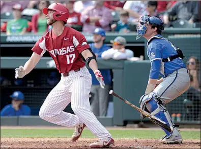  ?? NWA Democrat-Gazette/ANDY SHUPE ?? Arkansas senior Luke Bonfield watches his home run against Kentucky in March at Baum Stadium in Fayettevil­le. Entering the College World Series, Bonfield is batting .307 with 8 home runs and 39 RBI.