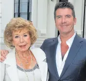  ??  ?? ‘I talk to my mum every day’...Cowell and Julie.