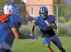  ?? LUIS SANCHEZ SATURNO/THE NEW MEXICAN ?? St. Michael’s Hayden Lee runs a drill Monday during practice. Lee also plays for the soccer team.