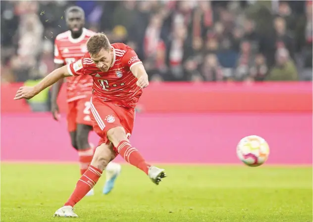  ?? Associated Press ?? Bayern Munich’s Joshua Kimmich scores ↑ a goal against Cologne during their Germany League match.