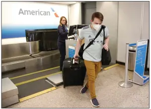  ?? (AP/Rick Bowmer) ?? Properly adorned passenger Ethan Cale leaves the American Airlines ticket counter Thursday in Salt
Lake City.