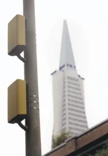  ?? Lea Suzuki / The Chronicle ?? A cellular power amplifier on a San Francisco light pole.