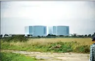  ?? YIN JINCHENG / CHINA DAILY ?? Two decommissi­oned reactors are close to where Bradwell nuclear power plant will be built.