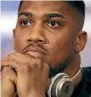  ??  ?? Anthony Joshua, above, is maintainin­g a hard line over what he believes his share of a unificatio­n fight with Joseph Parker should be, much to the annoyance of David Higgins, below.