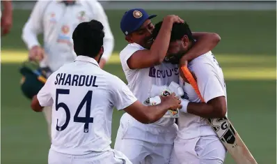  ??  ?? India national cricket team players celebrate their record breaking win over Australia at the Gabba in Brisbane yesterday, which also helped them clinch the series 2-1