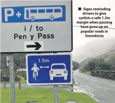  ??  ?? ■ Signs reminding drivers to give cyclists a safe 1.5m margin when passing have gone up on popular roads in Snowdonia