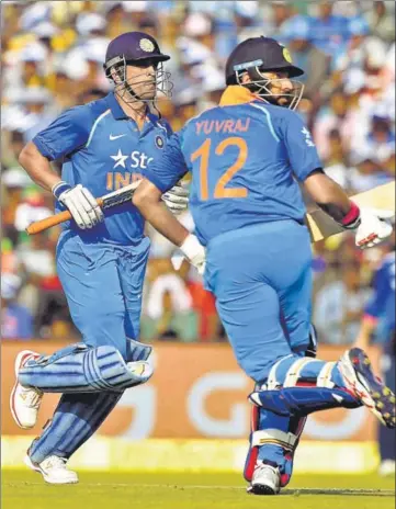  ?? PTI ?? MS Dhoni (left) and Yuvraj Singh added 256 runs for the fourth wicket against England on Thursday. Yuvraj announced his comeback with his first ODI ton in six years, while Dhoni helped himself to his 10th ODI century as India recorded 381/6.