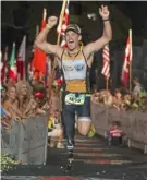  ?? Larry Rosa/endurapix.com ?? Eric McElvenny crossing the finish line at the Ironman World Championsh­ips in Kailua-Kona, Hawaii, in October 2013.