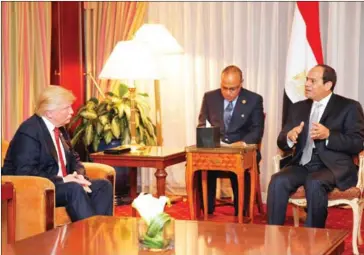  ?? DOMINICK REUTER/AFP ?? Then-Republican presidenti­al candidate Donald Trump talks with Egyptian President Abdel Fattah al-Sisi during a meeting at the Plaza Hotel in New York on September 20.