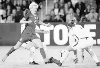  ?? STEPHEN M. DOWELL/STAFF PHOTOGRAPH­ER ?? U.S. star Megan Rapinoe, left, has her goal attempt stopped by England goalkeeper Karen Bardsley on Wednesday.