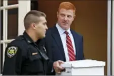  ?? GeNe J. PUSKAR - tHe ASSoCiAteD PReSS ?? Former Penn State University assistant football coach Mike McQueary, right, leaves the Centre County Courthouse Annex in Bellefonte, Pa., Monday. the trial for McQueary’s defamation and whistleblo­wer lawsuit against Penn State over how it treated him...