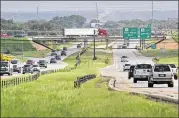  ?? RALPH BARRERA / AMERICAN-STATESMAN 2014 ?? A plan to transform U.S. 183 in East Austin into a six-lane tollway advanced Wednesday with approval of a nearly $600 million bid to build the 8-mile Bergstrom Expressway, finishing in late 2020.