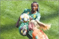  ?? Philippe Huguen / AFP / Getty Images ?? The Netherland­s’ Kika van Es, right, vies with Cameroon’s Ajara Nchout for the ball Saturday.