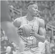  ?? Elizabeth Conley / Houston Chronicle ?? Hornets center Dwight Howard takes down a defensive rebound during Charlotte’s 108-96 loss to the Rockets at Toyota Center on Wednesday.