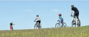  ??  ?? Bike rides on traffic-free paths or quiet roads are a great way to get outdoors with your children, visit new places and enjoy a guilt-free coffee