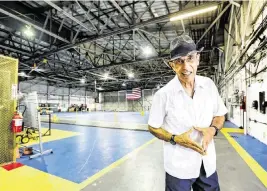  ?? AL DIAZ adiaz@miamiheral­d.com ?? Armando Martinez, in a 1927 hangar built by Pan American Airways founder Juan Tripp, is part of a group asking Miami-Dade County to designate the hangar, the oldest standing structure at the airport, as a historic landmark.