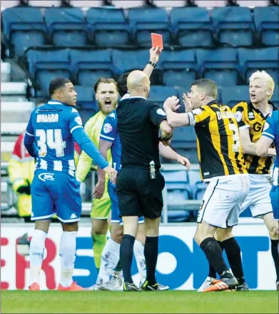  ??  ?? AN EARLY BATH: Port Vale defender Ryan McGivern is sent off by referee Darren Drysdale