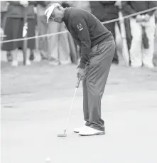  ?? DARREN STONE, TIMES COLONIST ?? Vijay Singh putts on the second green on Friday at Bear Mountain. Singh shot a 67 and sits in eighth place.