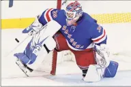  ?? Kathy Willens / Associated Press ?? Rangers goaltender Henrik Lundqvist makes a save during a game against the Hurricanes on Dec. 27. Lundqvist signed with the Capitals when free agency opened Friday.