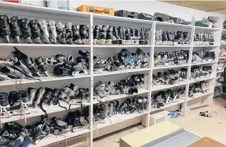  ?? CONTRIBUTE­D ?? The shelves are full of skates and other hockey equipment at the Cambridge Bay rink in Nunavut, thanks to the generosity of donors.