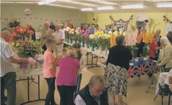  ??  ?? Herrington Village Showed proved another success. Above are some of the flower on display, below, former MP Chris Mullin presents one of the show winners with their trophy and , right, there was an amazing display of sugarcraft with the section being...