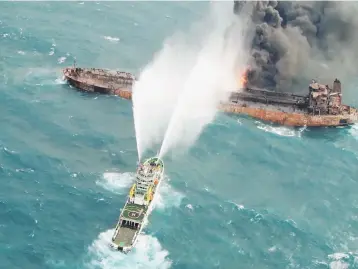  ?? Reuters photo ?? A rescue ship works to extinguish the fire on the stricken Iranian oil tanker Sanchi in the East China Sea, on January 10, in this photo provided by Japan’s 10th Regional Coast Guard. —