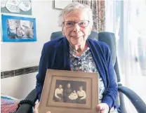  ?? PHOTO: SHANNON THOMSON ?? Generation­s . . . Dulcie Armitage, of Alexandra, holds a photo of herself as a baby with her mother, grandmothe­r and greatgrand­mother. Mrs Armitage turns 100 today.