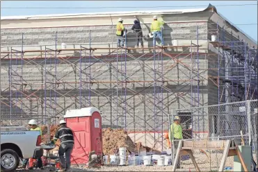  ?? Doug Walker ?? A new Discount Tire is rising in the East Bend shopping center off Turner Mccall Boulevard. The shopping center was developed with the aid of a TAD package from Rome and Floyd County.