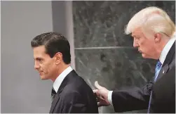  ?? DARIO LOPEZ-MILLS/ASSOCIATED PRESS ?? Then-presidenti­al candidate Donald Trump, right, walks with Mexico President Enrique Peña Nieto in Mexico City on Aug. 31, 2016.