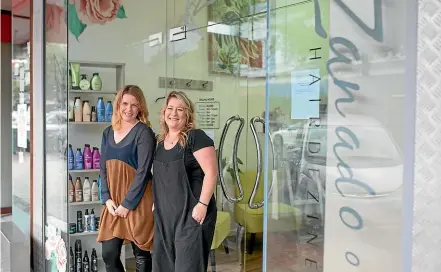  ?? SIMON O’CONNOR/STUFF ?? Natalia Voyle and Lorraine Elstone of Zanadoo Hairdezine have been using the SOS Business website to sell vouchers while they have been closed during the lockdown.