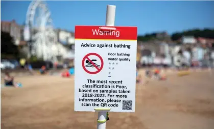  ?? ?? Warning signs on the beach at Scarboroug­h, north Yorkshire, as a result of sewage discharge into the sea. Photograph: Richard Saker/The Guardian