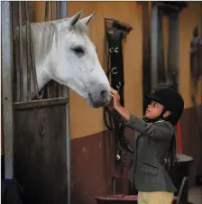  ??  ?? Pictured at the Blennervil­le Equestrian Centre. Aithali Mulumba aged 10 with Blennervil­lie Lady