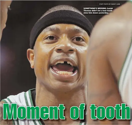  ?? STAFF PHOTO BY NANCY LANE ?? SOMETHING’S MISSING: Isaiah Thomas didn’t let a lost tooth slow him down yesterday.