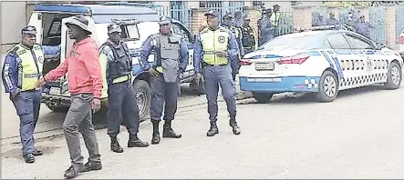  ?? (Pic: Sibusiso Zwane) ?? Some of the police officers who were at Manzini Police Station when a group of public transport workers marched to demand the release of their colleague, who was arrested during a protest action that turned violent at the Manzini Bus Rank on Thursday.