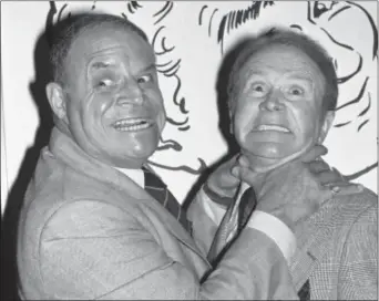  ?? LENNOX MCLENDON — THE ASSOCIATED PRESS FILE ?? In this file photo, comedian Don Rickles, left, pretends to strangle fellow comedian Red Buttons prior to an Annual Stag Roast in Los Angeles. Rickles died Thursday of kidney failure at his Los Angeles home. He was 90.