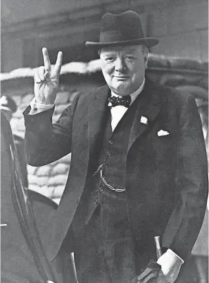  ?? AP ?? British Prime Minister Winston Churchill gives a “Victory Salute” on Aug. 27, 1941. A June 1940 Gallup poll showed he had an 88 percent approval rating.