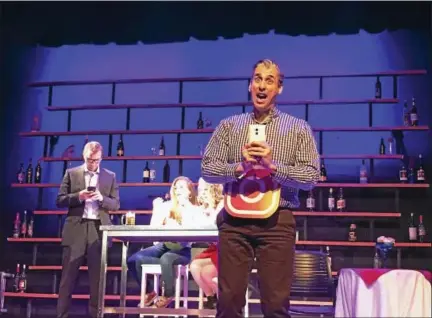  ?? CONTRIBUTE­D PHOTOS ?? Jimmy Donahue as the waiter performs a scene from the Goshen Players’ production of the musical comedy, “First Date,” which opens Friday night at the Old Town Hall in Goshen.